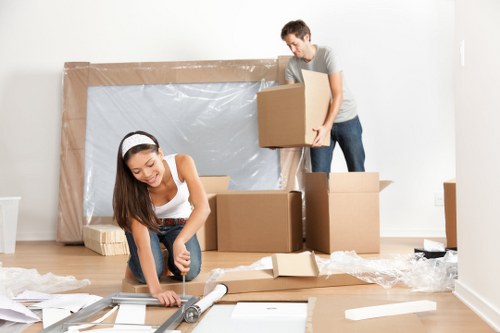 Flat move preparation in Pimlico with boxes and wrapped furniture
