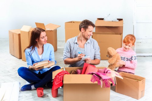 Packed moving boxes in a Pimlico apartment interior