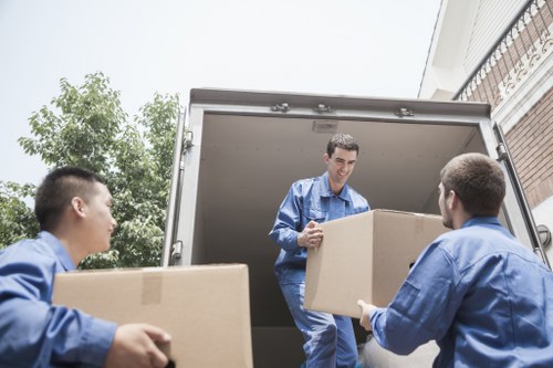 Moving van and household boxes prepared for a Pimlico house removal