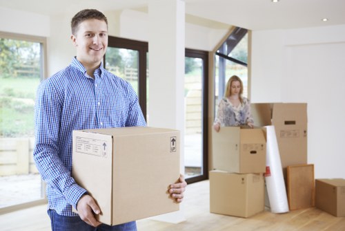 Local moving team handling boxes and furniture near Pimlico