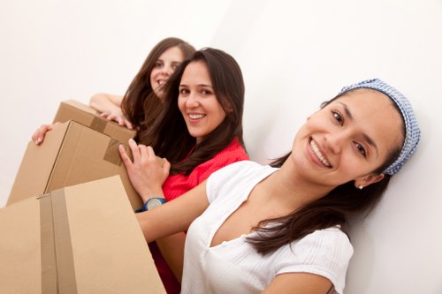 Professional movers navigating stairs in a Pimlico flat move