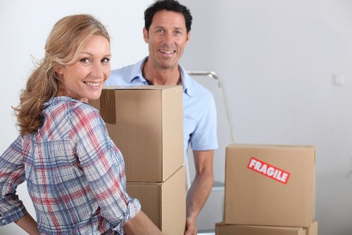 Business relocation team handling office boxes and furniture in Pimlico
