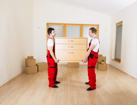 Moving team working around narrow access and parking in central London